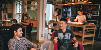 Two men working in coffee shop