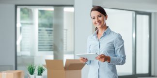 Businesswoman in her office using a tablet