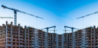 Panorama of construction at the background of blue sky