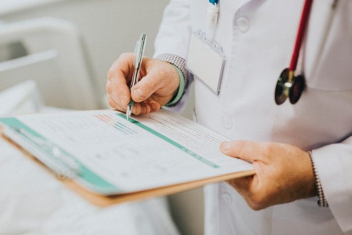 Physician with clipboard