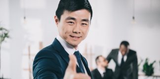 Businessman showing thumbs-up