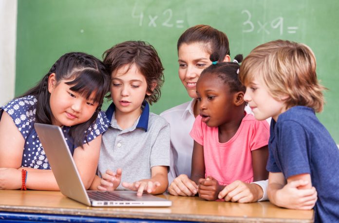 Children looking at computer