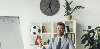 Man in office with soccer ball