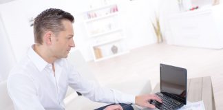 Man using a laptop at home