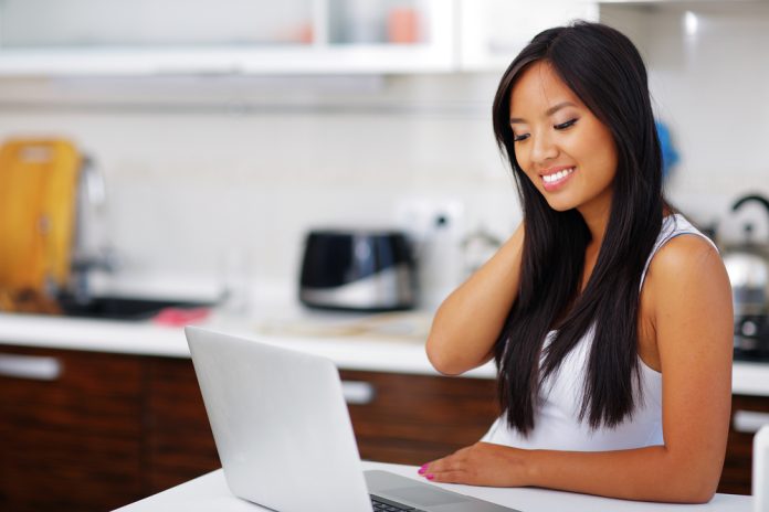 Woman with laptop at home