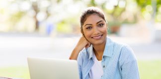 Woman using laptop outdoors