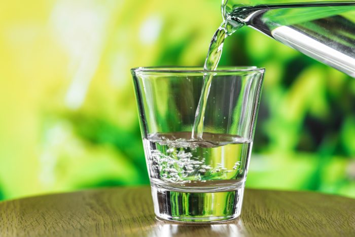 Pouring water in glass