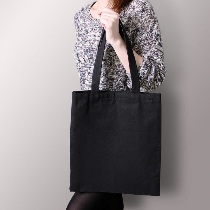 Woman holding tote bag