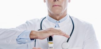 Doctor holding CBD oil