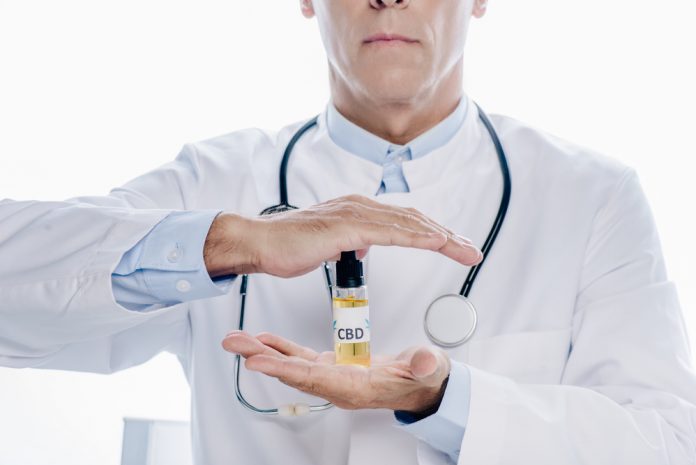 Doctor holding CBD oil