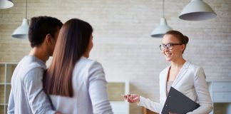 Realtor talking to a young family