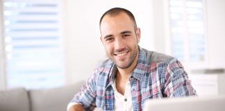 Man working on laptop computer from home