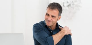 Businessman Suffering From Shoulder Pain