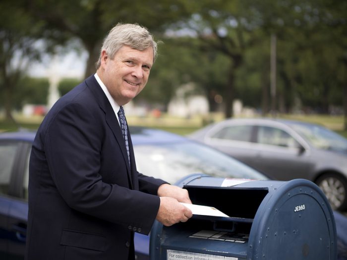 Man Mailing a Letter