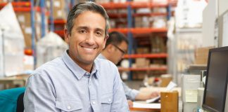 Businessman in Warehouse