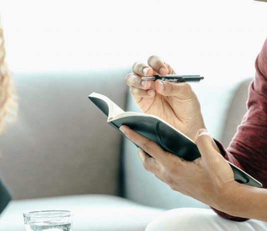 Man Holding a Pen