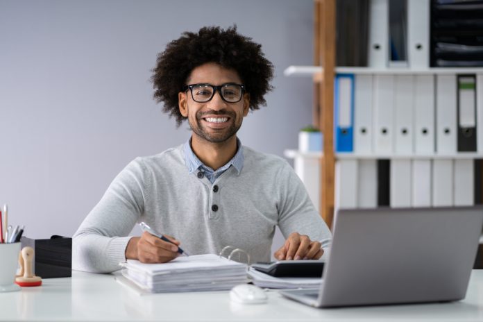 Businessman Calculating Finances