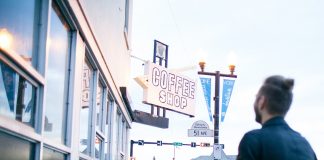 Man Looking at Sign