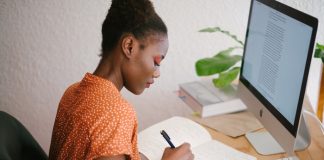 Woman Writing a Business Plan