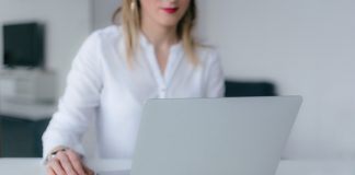 Woman using silver laptop