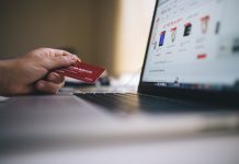 Person paying for online goods with credit card