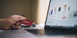 Person paying for online goods with credit card