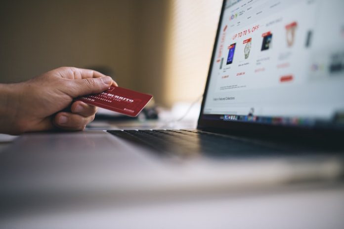 Person paying for online goods with credit card