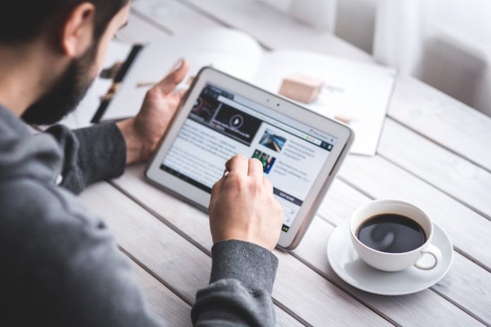 Man Working on Tablet