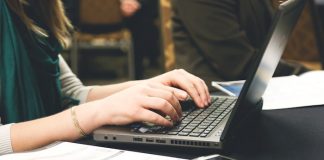 Woman typing on laptop