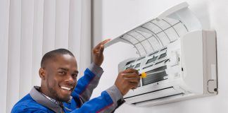 Technician Repairing Air Conditioner