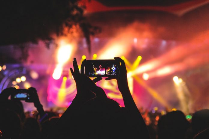 Person Taking Photo at Concert