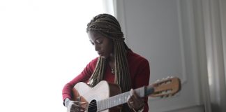 Woman Playing Guitar