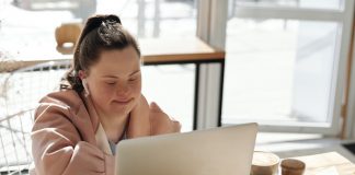 Woman with Down Syndrome Working on Laptop