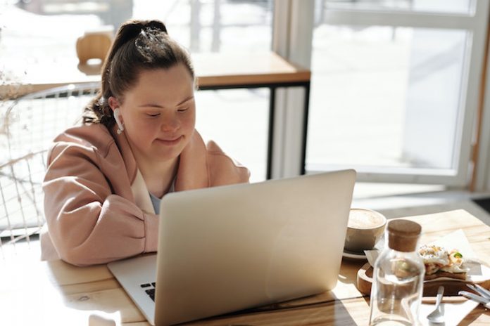Woman with Down Syndrome Working on Laptop