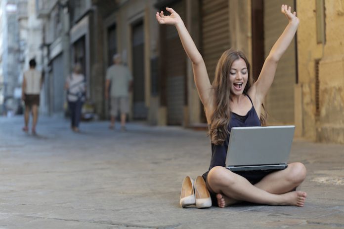 Happy Woman on Laptop