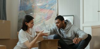 Couple Packing Moving Boxes