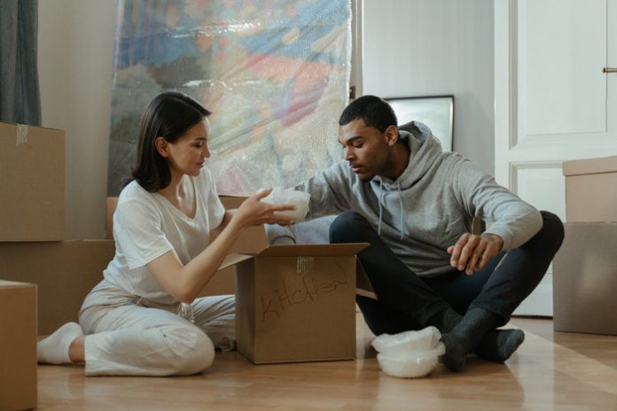 Couple Packing Moving Boxes