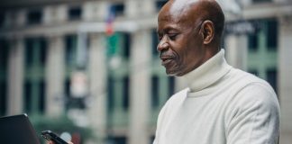 Businessman Looking at Mobile Phone