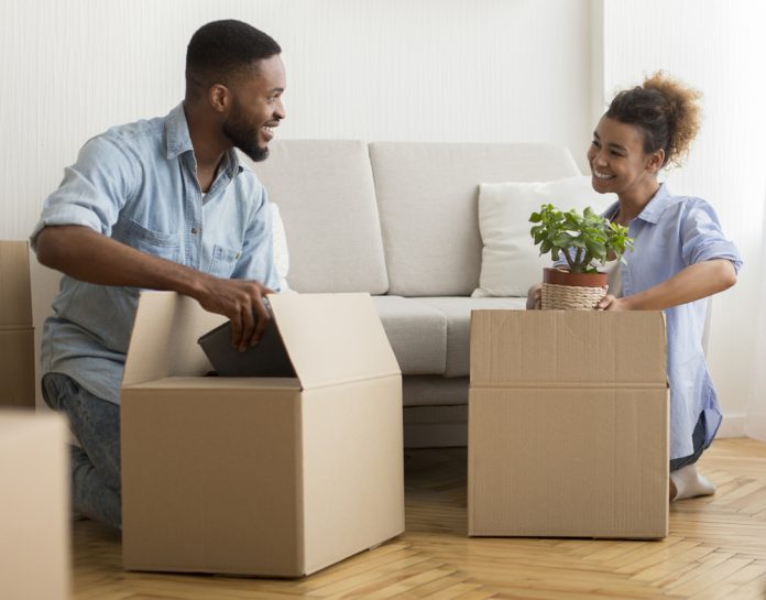 Couple Packing Boxes at Home