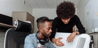 Two Men Working on Laptop