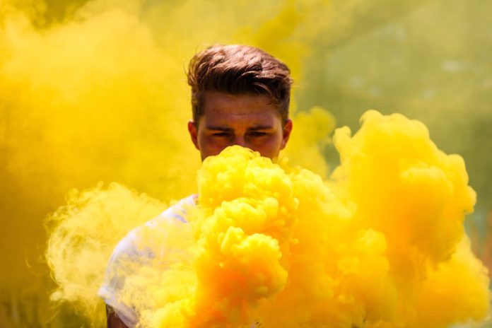 Man with Yellow Smoke