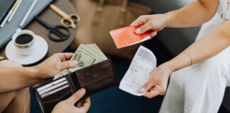 Person Paying with Cash