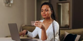 Woman Looking at Credit Card