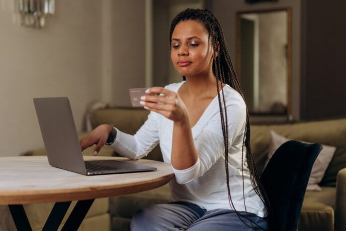 Woman Looking at Credit Card