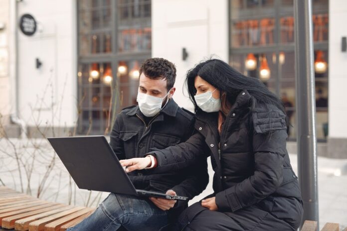 People looking at computer