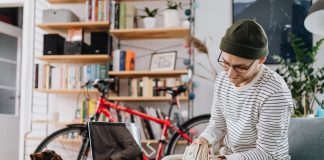 Person assessing small fees of small businesses