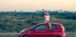 Person sitting on car