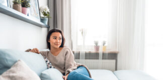 Person relaxing in heated home