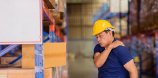 Business Person Lifting and Handling a Box