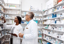 Pharmacists looking at healthcare labels
